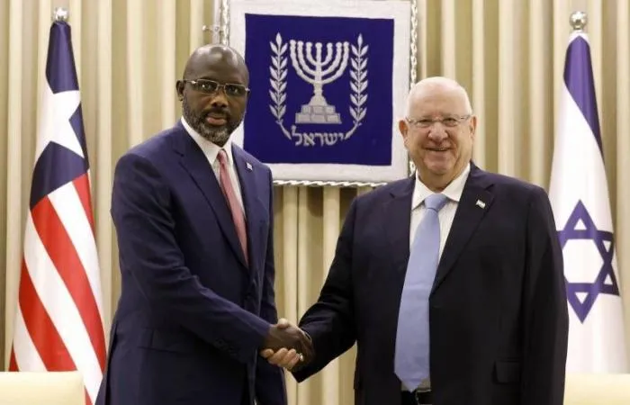 الرئيس الليبيري جورج ويا، والرئيس الإسرائيلي  رؤوفين ريفلين.
